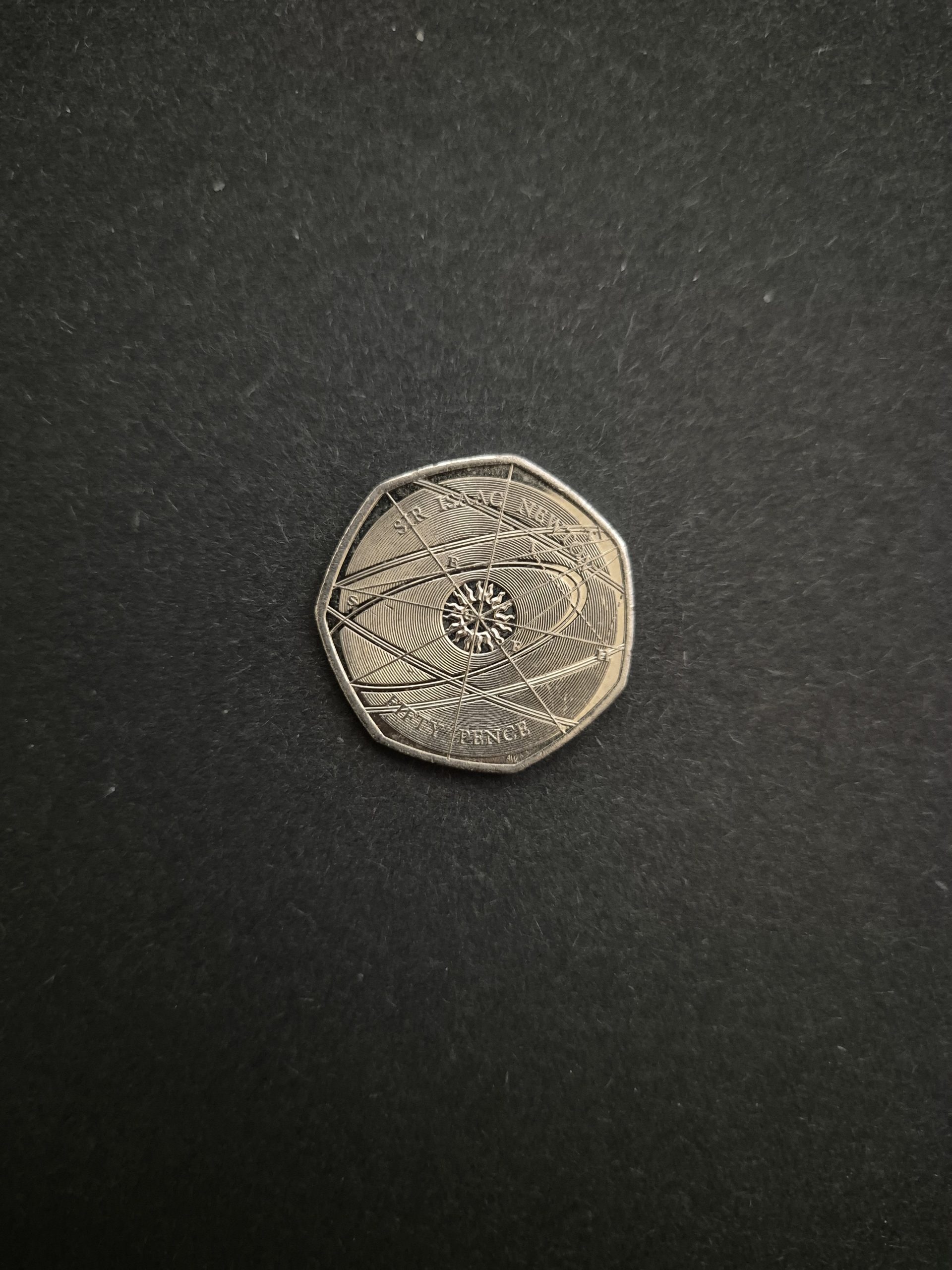 2017 Sir Isaac Newton 50p Coin - UK Commemorative Coin for Sale Image of a 2017 UK 50 pence coin featuring a design commemorating Sir Isaac Newton and his scientific contributions.