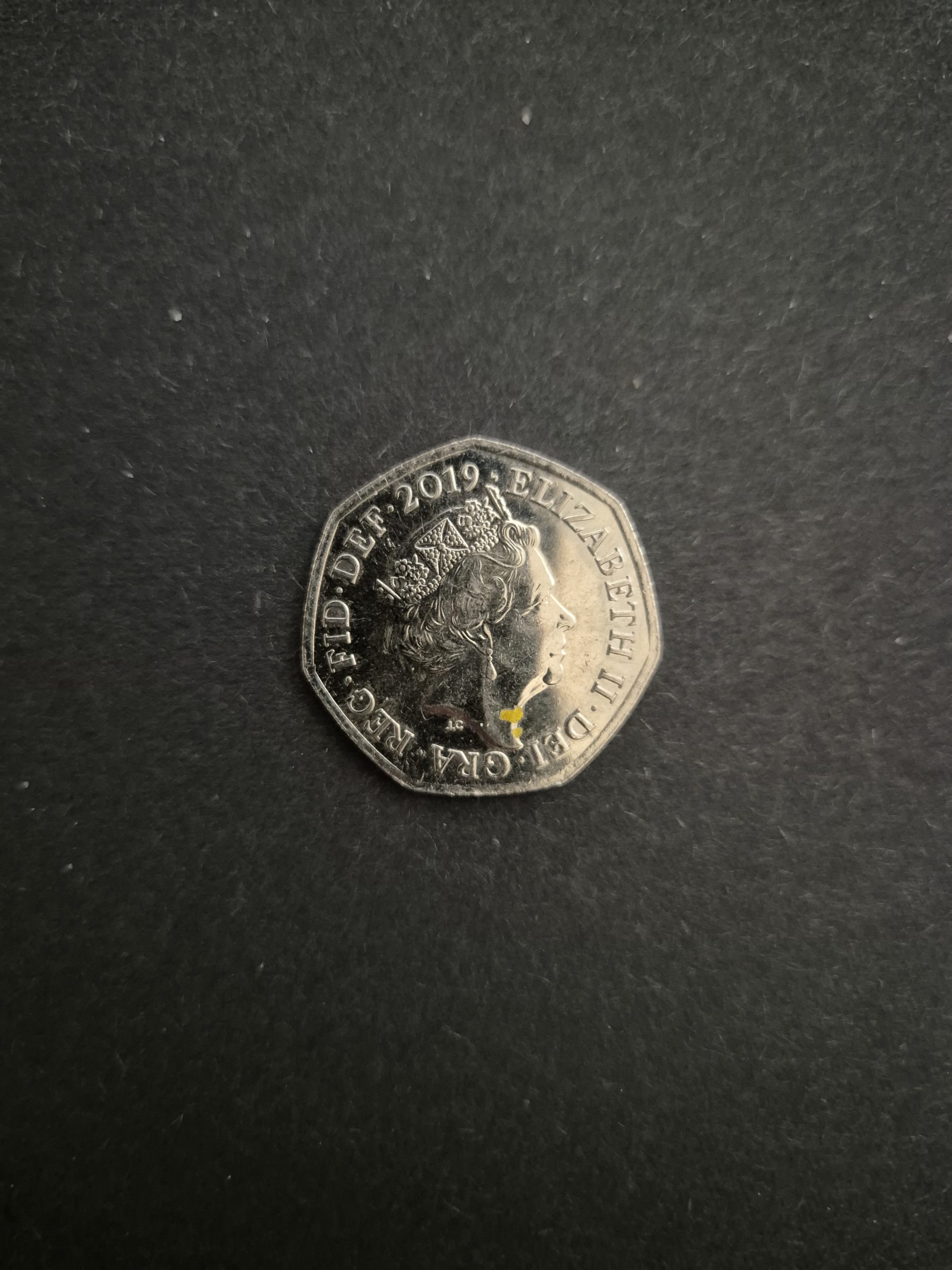 2019 Sherlock Holmes 50p Coin - UK Commemorative Coin for Sale Image of a 2019 UK 50 pence coin featuring Sherlock Holmes, showcasing the coin's design and details.