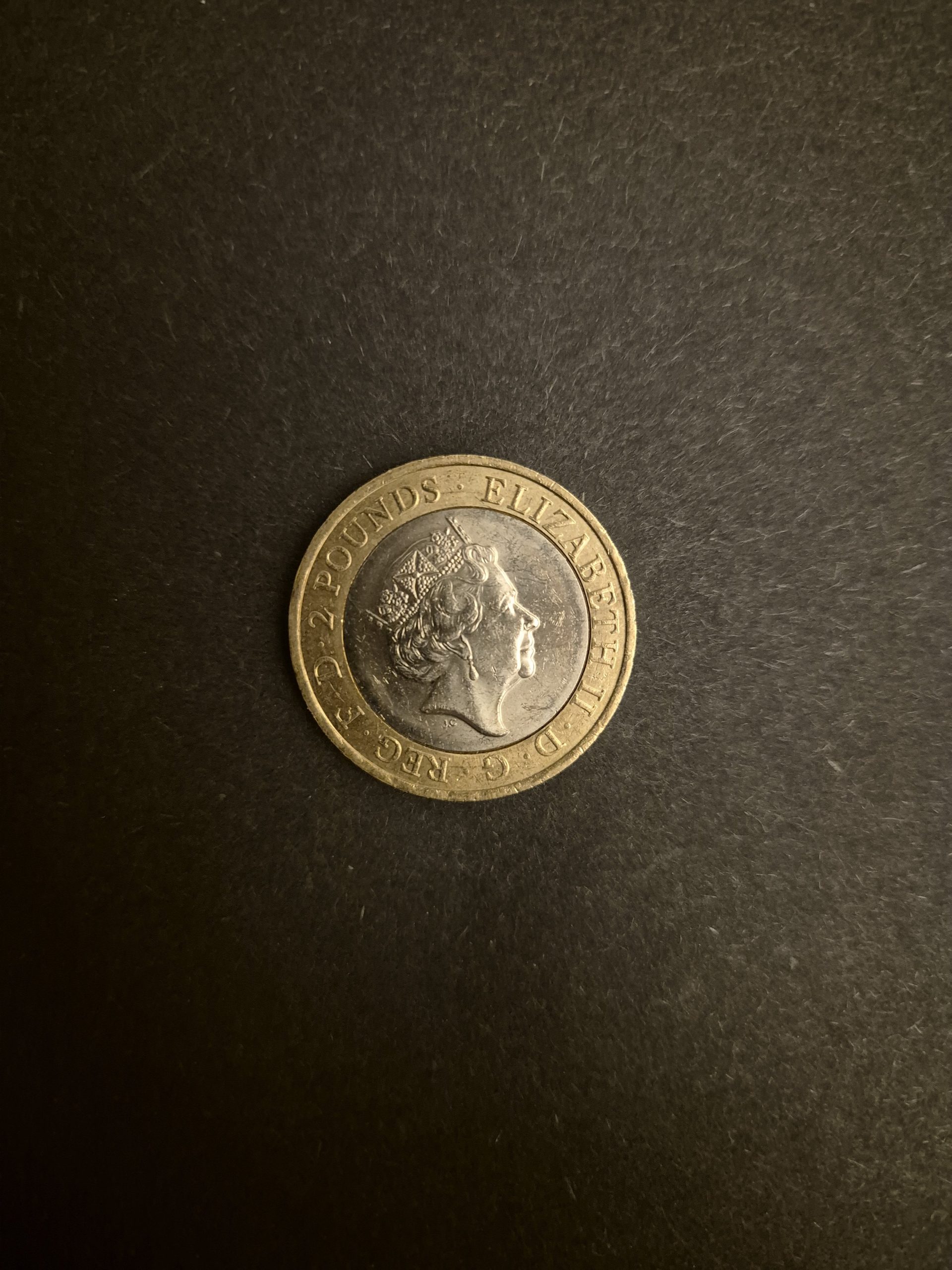 2016 William Shakespeare £2 Coin - Collectible British Two Pound Coin Close-up image of a 2016 William Shakespeare £2 British coin, featuring Queen Elizabeth II's profile on one side and a Shakespearean design on the other.