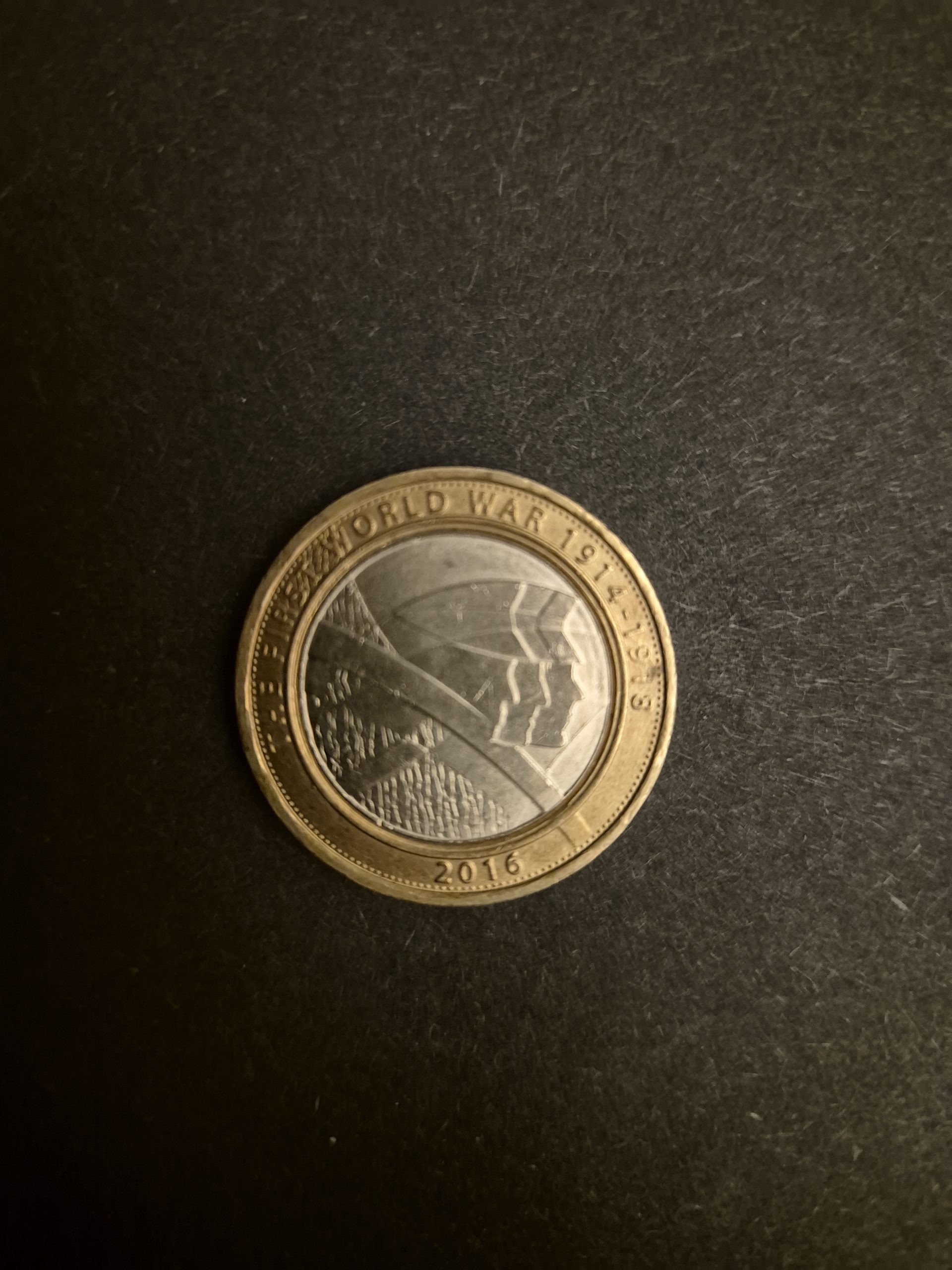 2016 First World War Commemorative £2 Coin - UK Collector's Item Image of a 2016 British £2 coin commemorating the First World War. The coin features a design depicting soldiers in trenches.