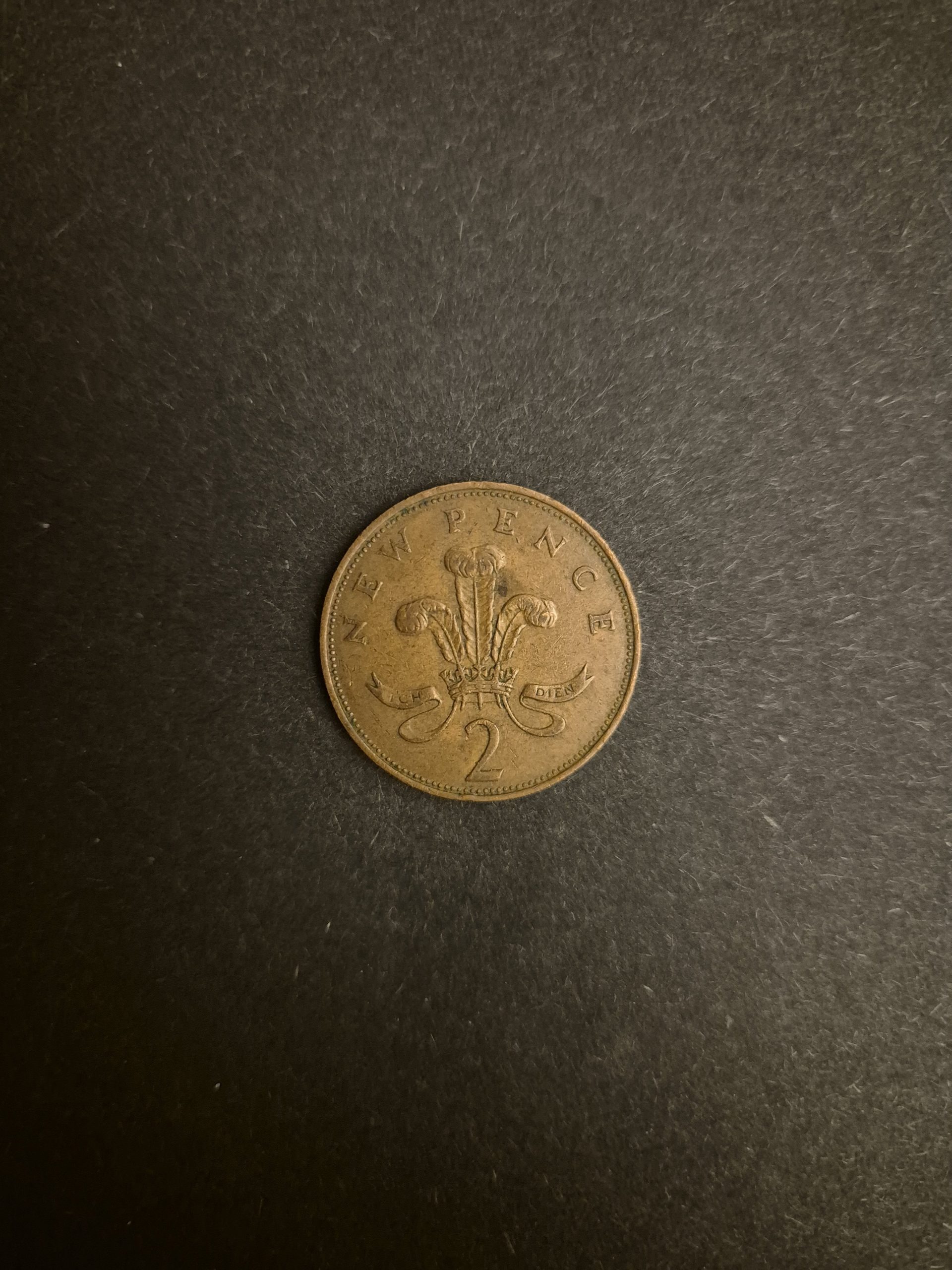 1971 2p New Pence Coin - British Currency Collectible Close-up of a 1971 British 2 New Pence coin featuring the Welsh Prince of Wales feathers.
