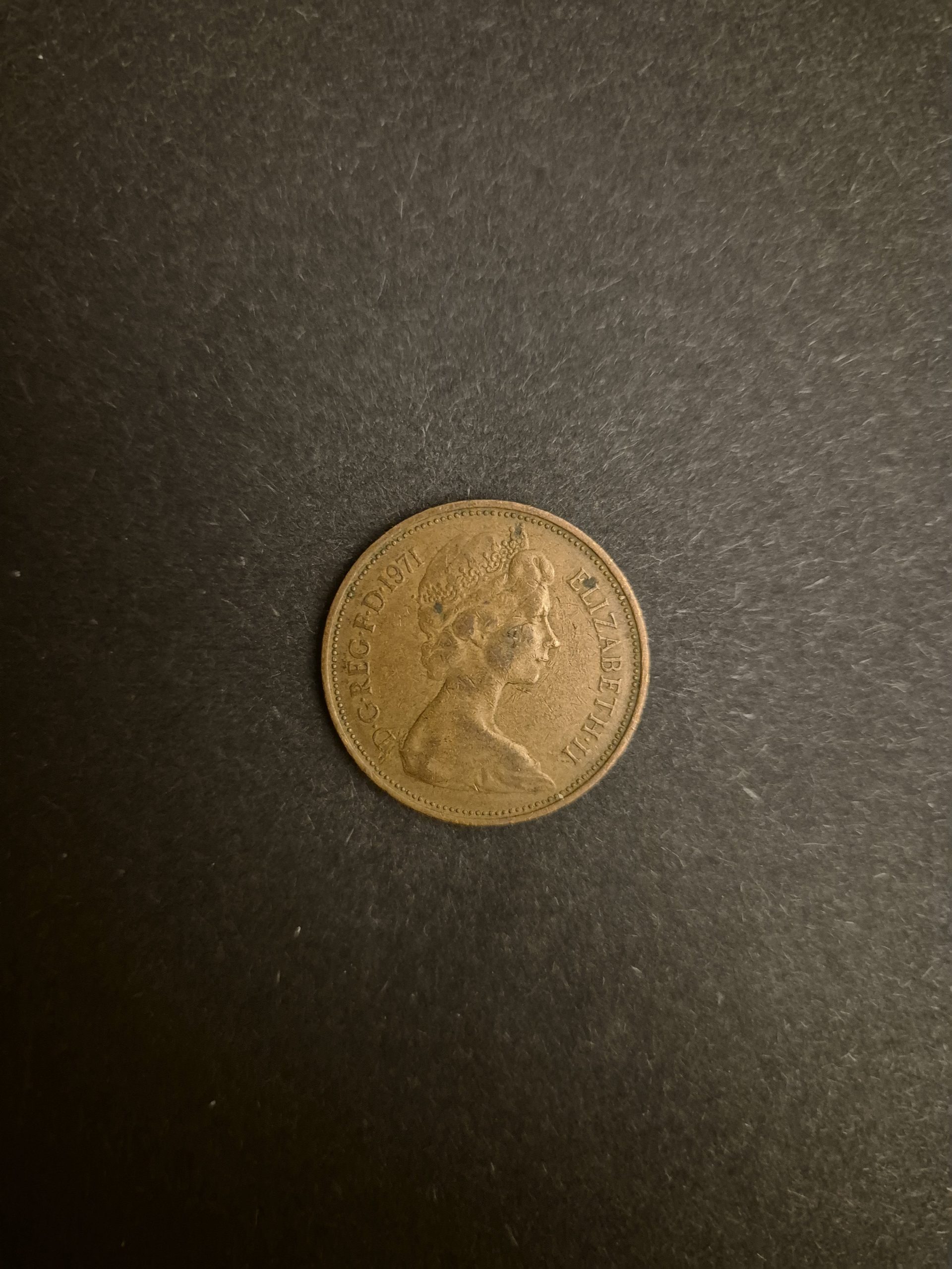 1971 2p New Pence Coin - British Coin, Queen Elizabeth II A close-up image of a 1971 British 2 pence coin featuring Queen Elizabeth II's profile.